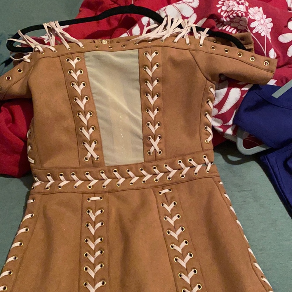 Sexy suede dress form fitting .